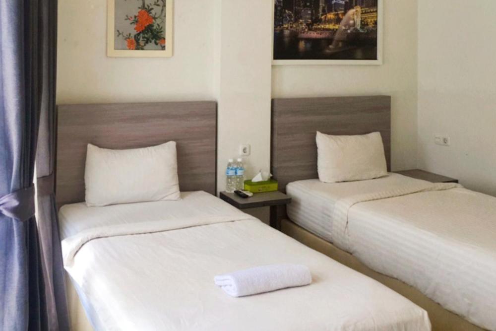 Twospaces Living At Maximus Inn Palembang Bagian luar foto