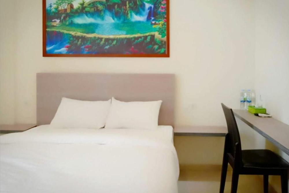 Twospaces Living At Maximus Inn Palembang Bagian luar foto